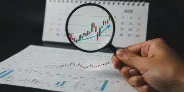 Financial chart with magnifying glass and 2026 calendar, symbolizing future interest rate analysis.