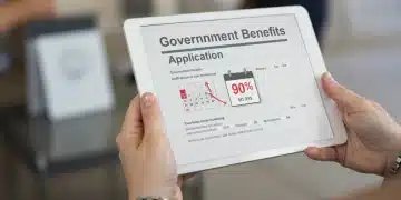 Hands holding tablet with federal unemployment benefits application form and 90-day deadline highlighted.
