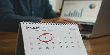 Calendar showing Q1 2026 with financial data on a laptop, symbolizing upcoming federal unemployment benefit changes.